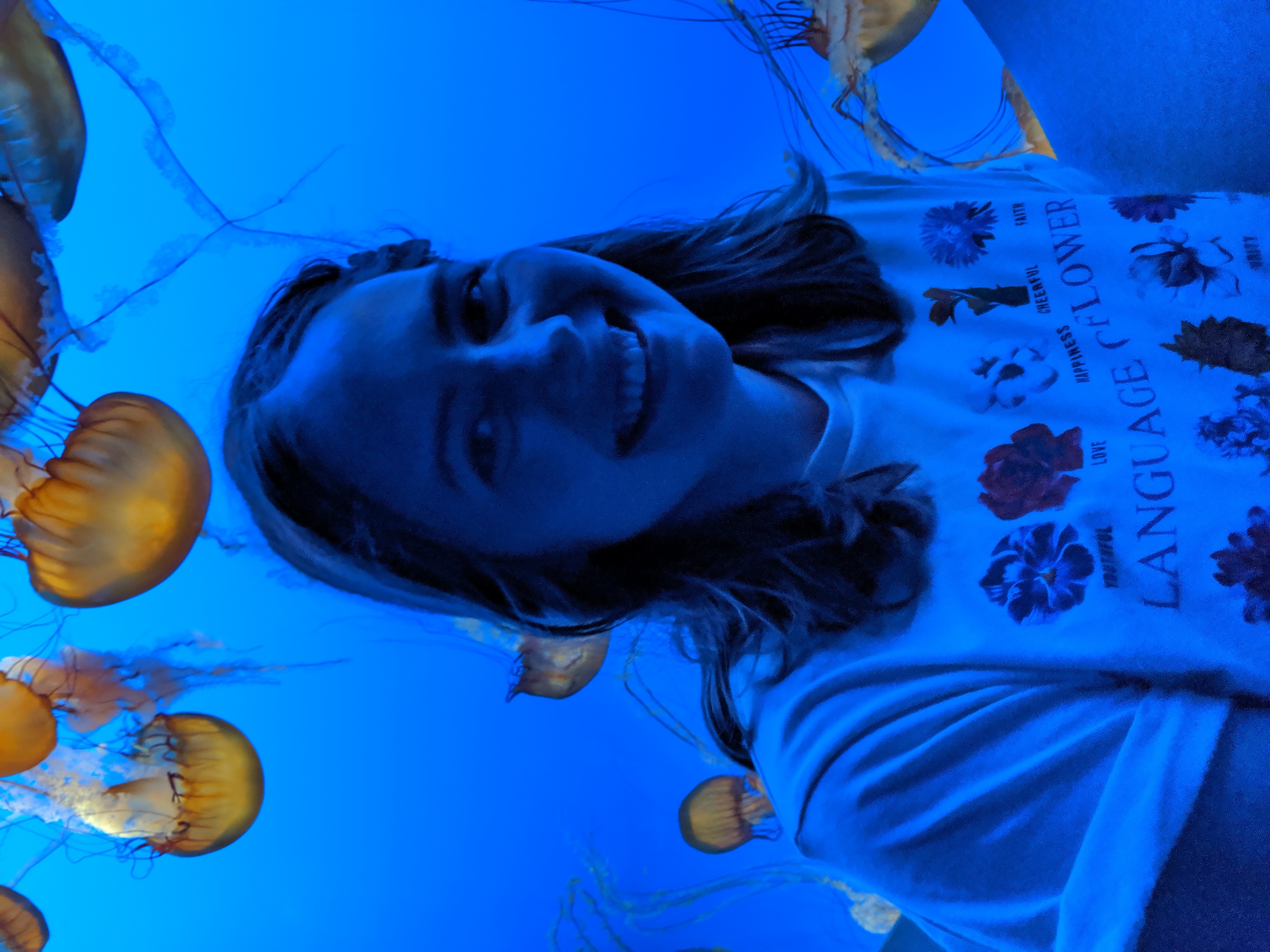 Nicole standing in front of jellyfish